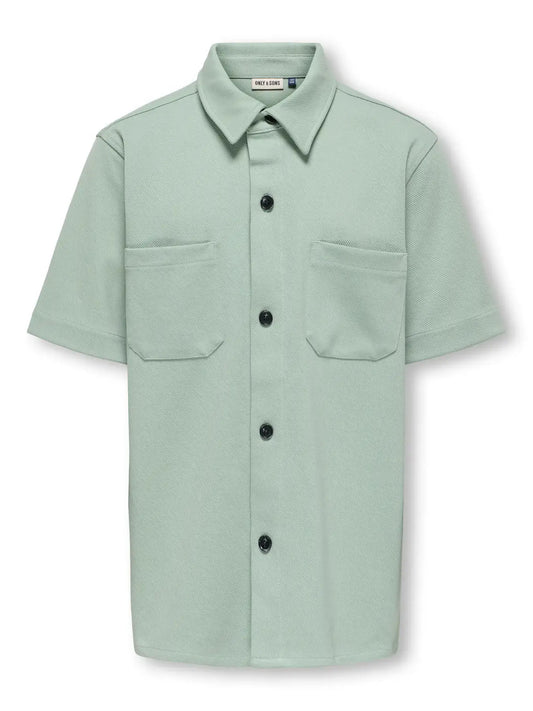 Kids Only & Sons NEWKODYL Blouse in Iceberg Green, short sleeve with button-up design and two front pockets.